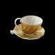Golden porcelain tea cup and saucer